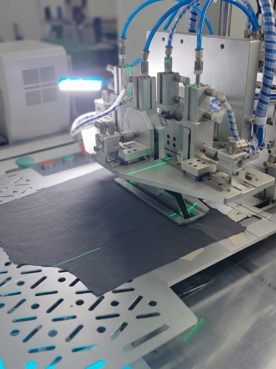 Laser-guided automated garment manufacturing equipment
